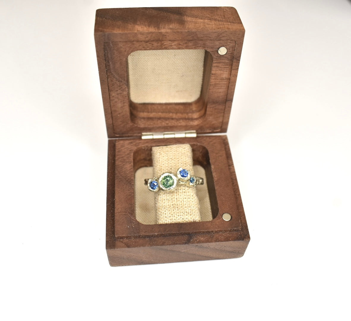 Ring in a wooden ring box. Inspired and made in Edale.