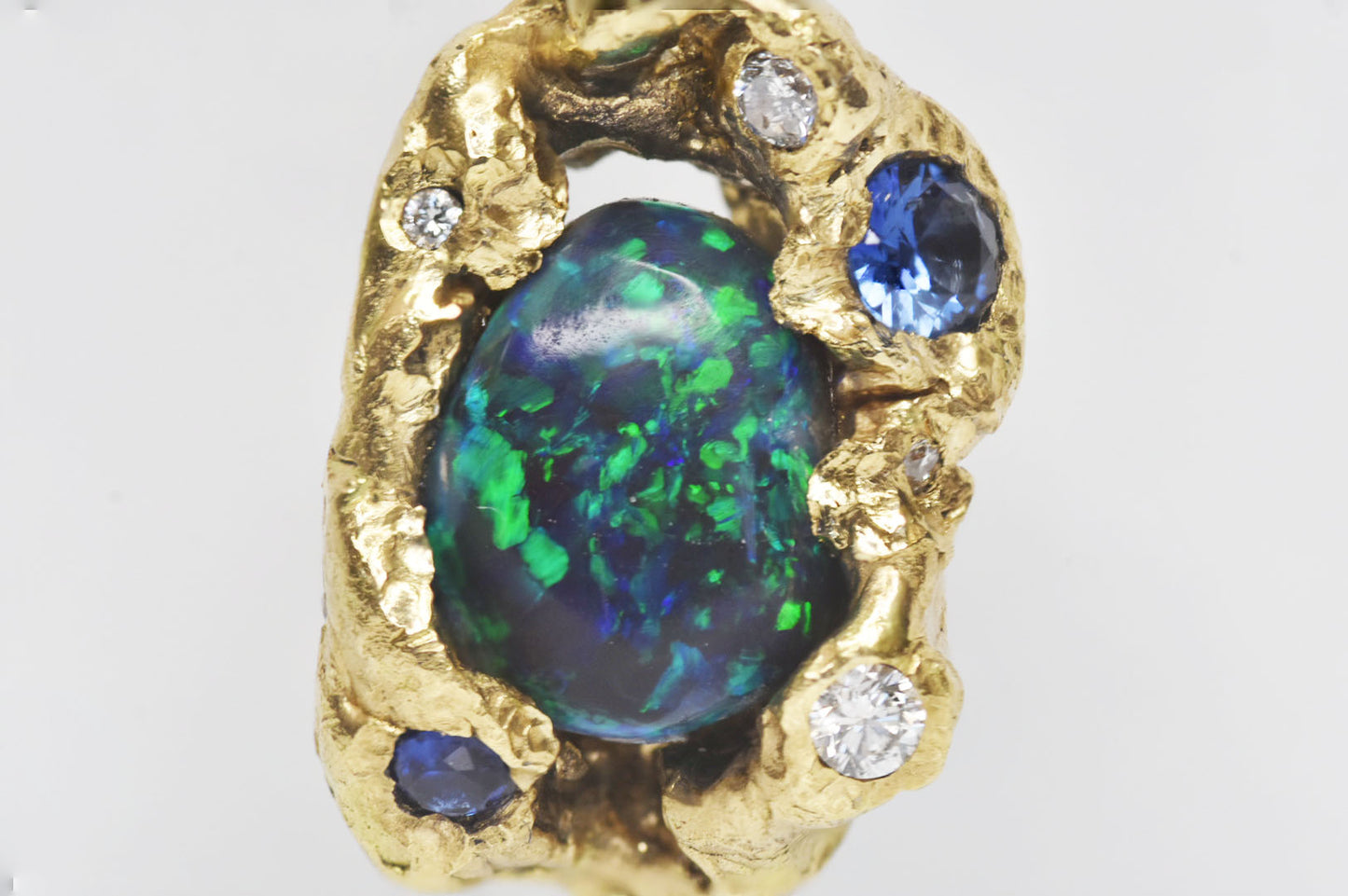 2.4 ct Black Opal, White Diamond, Cognac Diamond and Sapphire Ring. 18k Yellow Gold Pendant. Western Cliffs of Swanage.