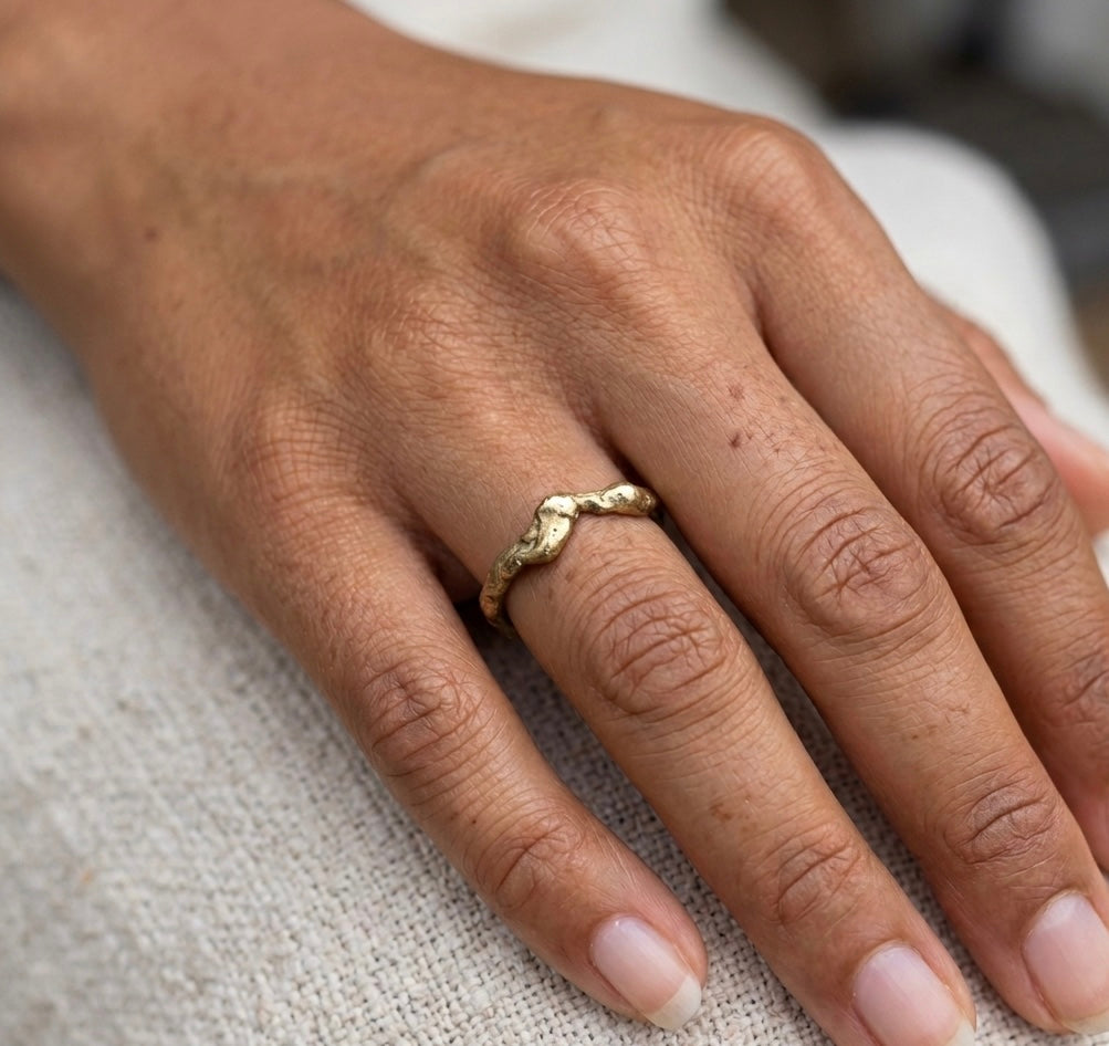 Organic gold wedding band made outdoors in st Ives Cornwall. Shem Hake jewellery