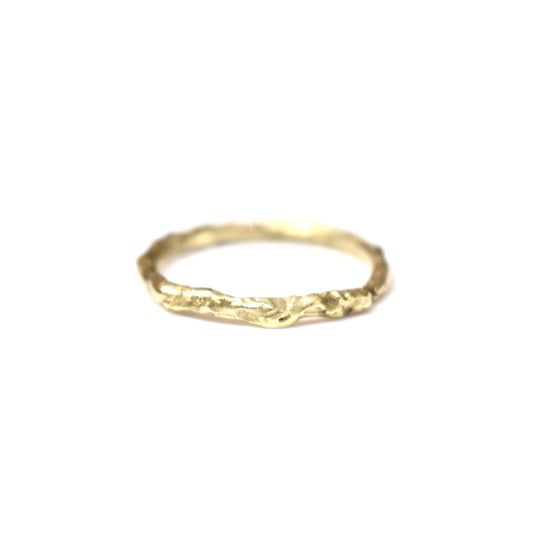 Organic gold wedding ring made outdoors in st Ives Cornwall. 