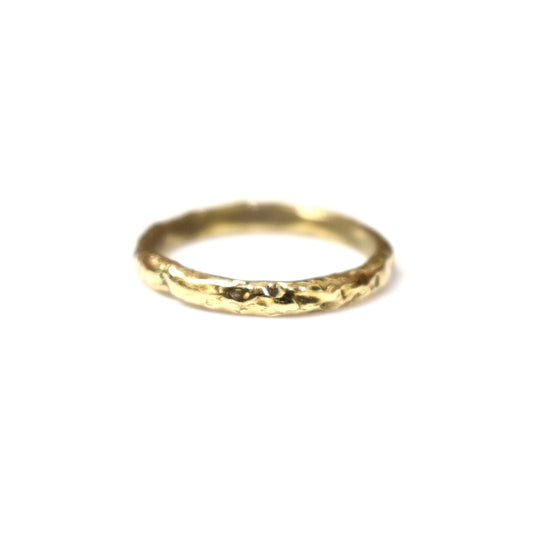 Organic gold wedding ring made outdoors in st Ives Cornwall. Shem Hake jewellery. 