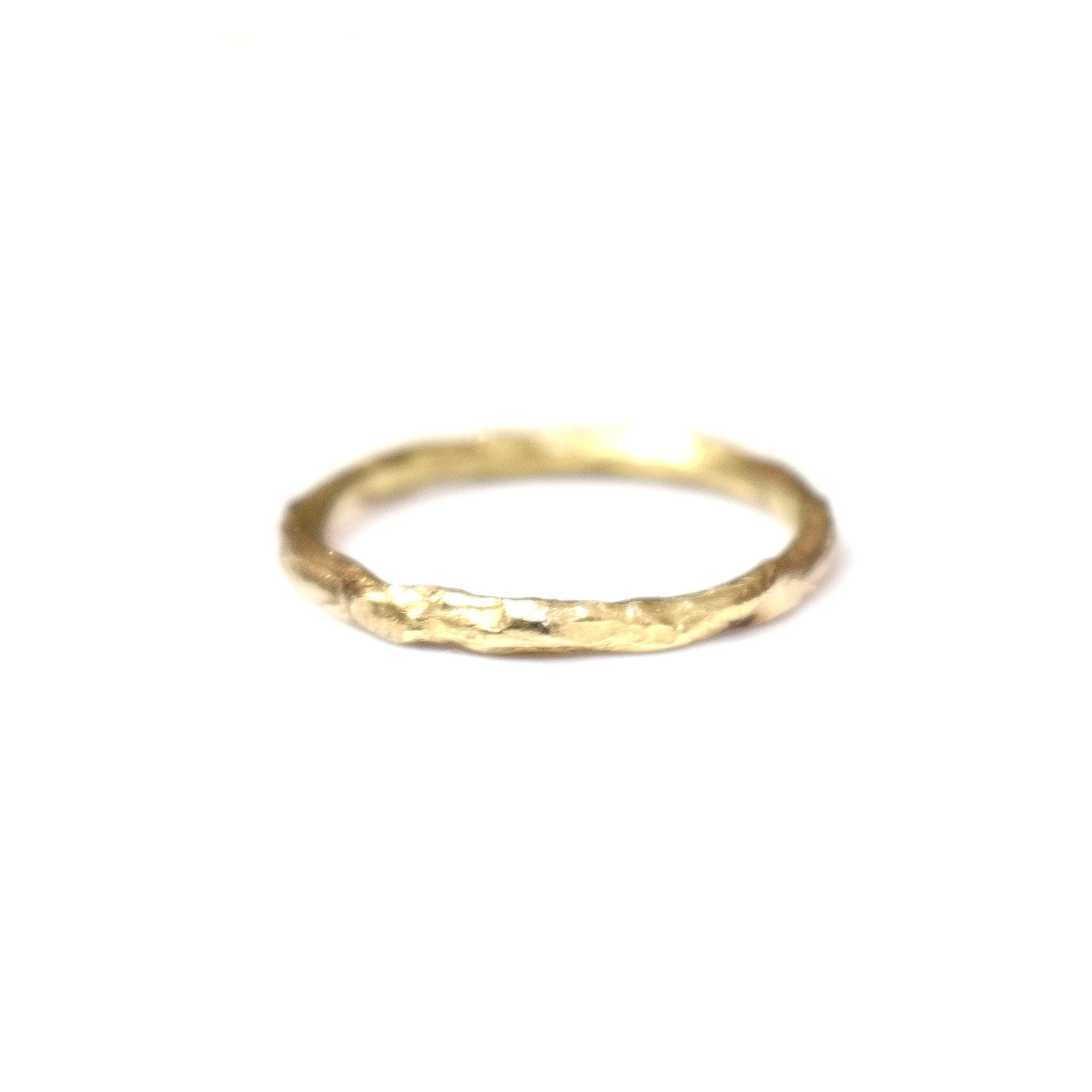 Organic gold wedding ring made outdoors in st Ives Cornwall. Shem Hake jewellery. 