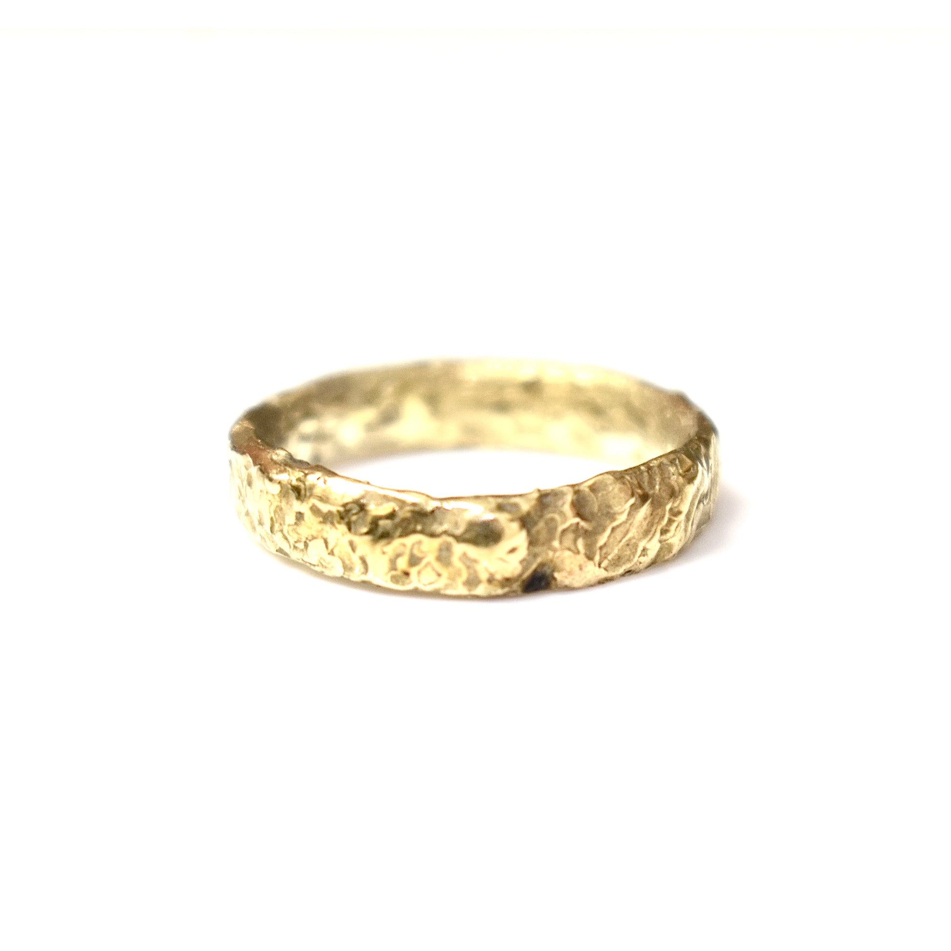 Organic gold wedding band made outdoors in st Ives Cornwall. Shem Hake jewellery. 