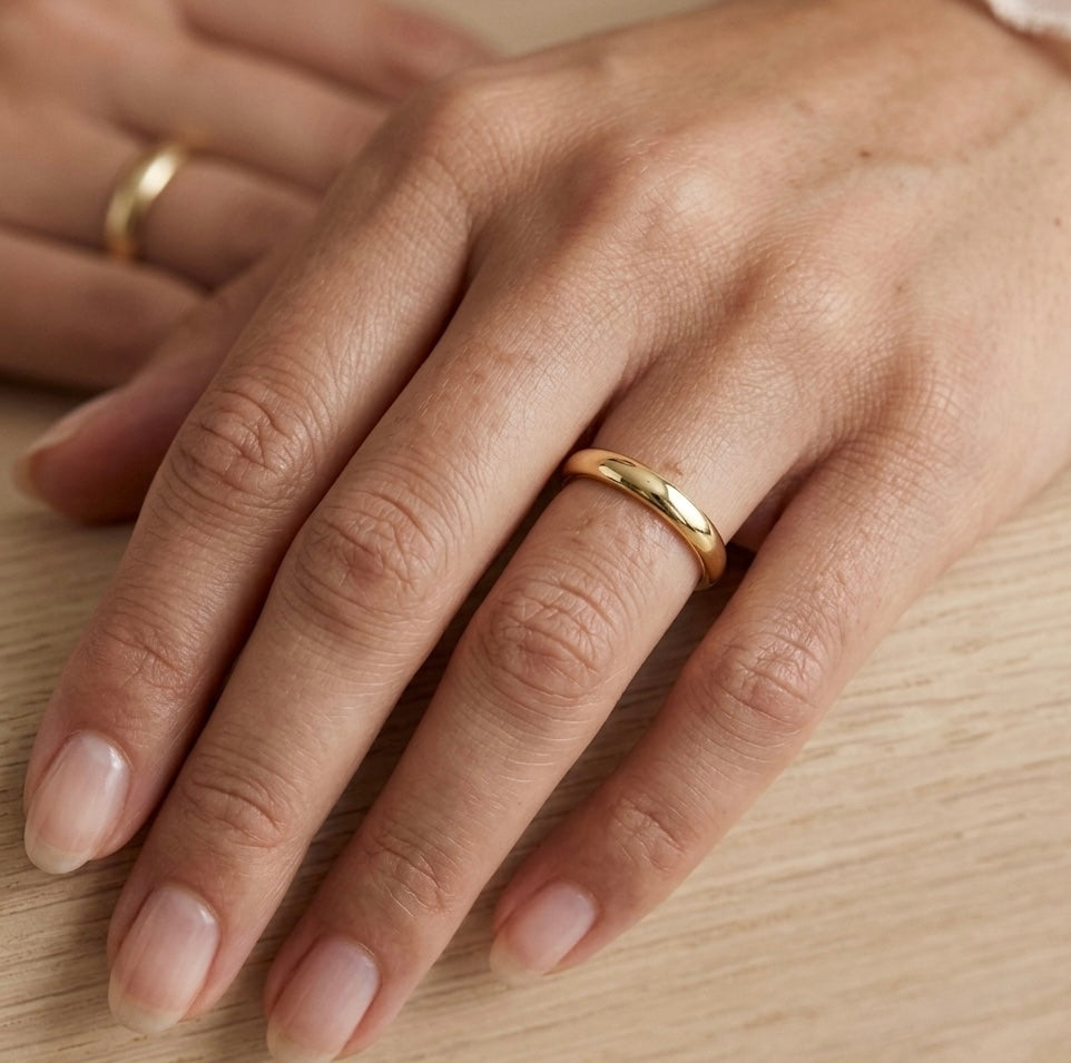 Polished gold wedding band made on the beach of st Ives Cornwall. 