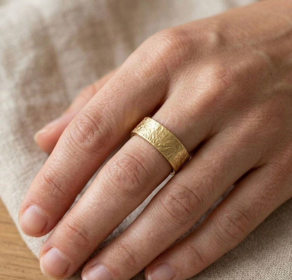 Gold textured wedding ring made in Cornwall. 
