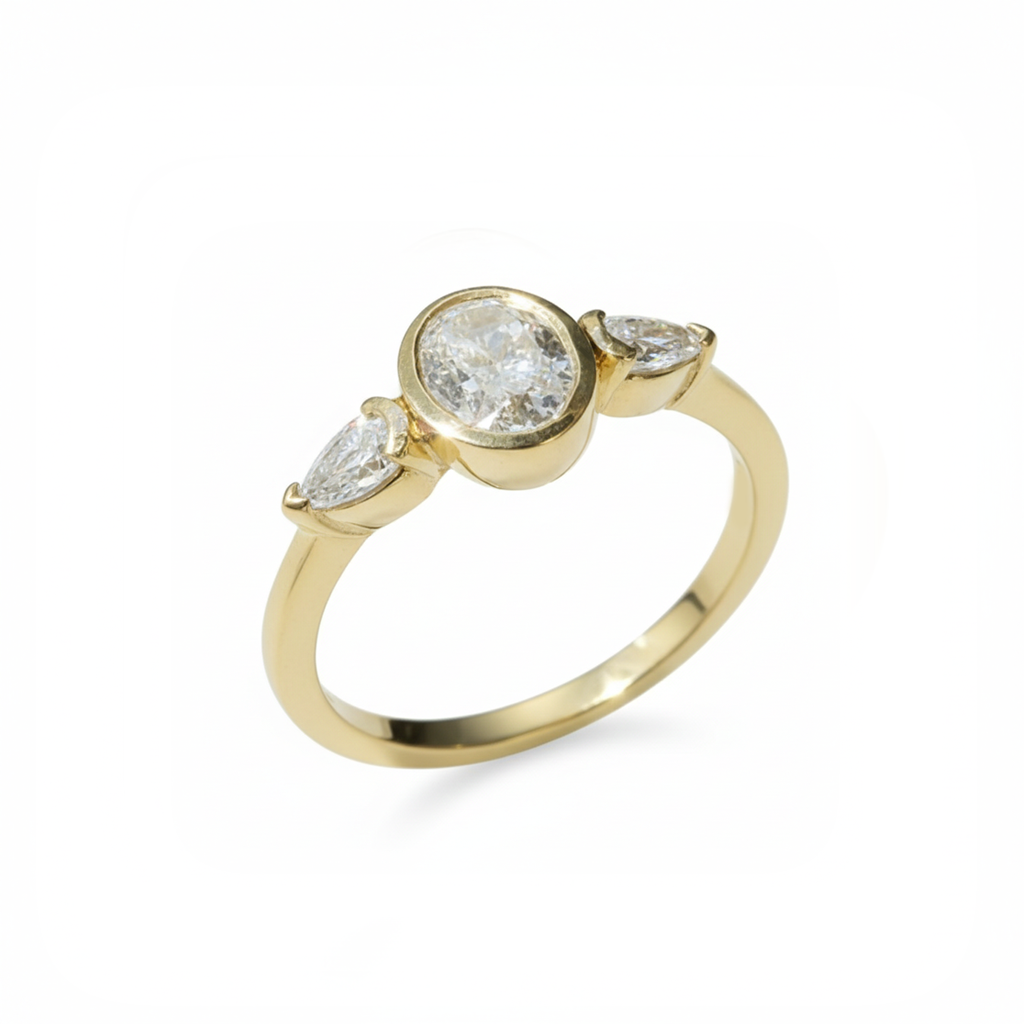 Gold ring with three diamonds on a white background