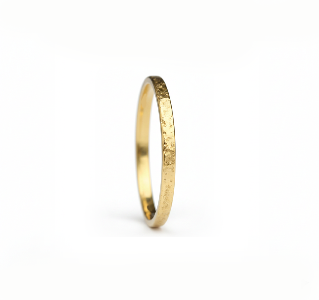 Textured yellow gold ring made in Cornwall. 