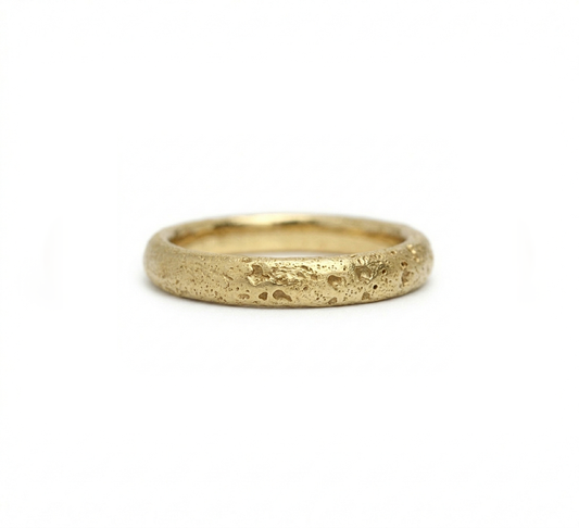 Gold ring with a textured surface, sand cast wedding ring. Made in Cornwall. 