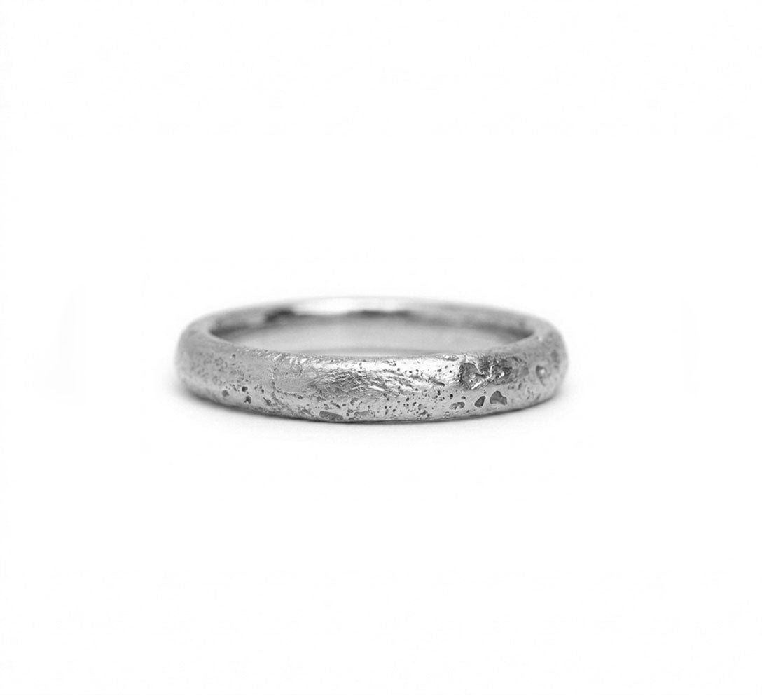 Platinum with a textured surface, sand cast wedding ring. Made in Cornwall.