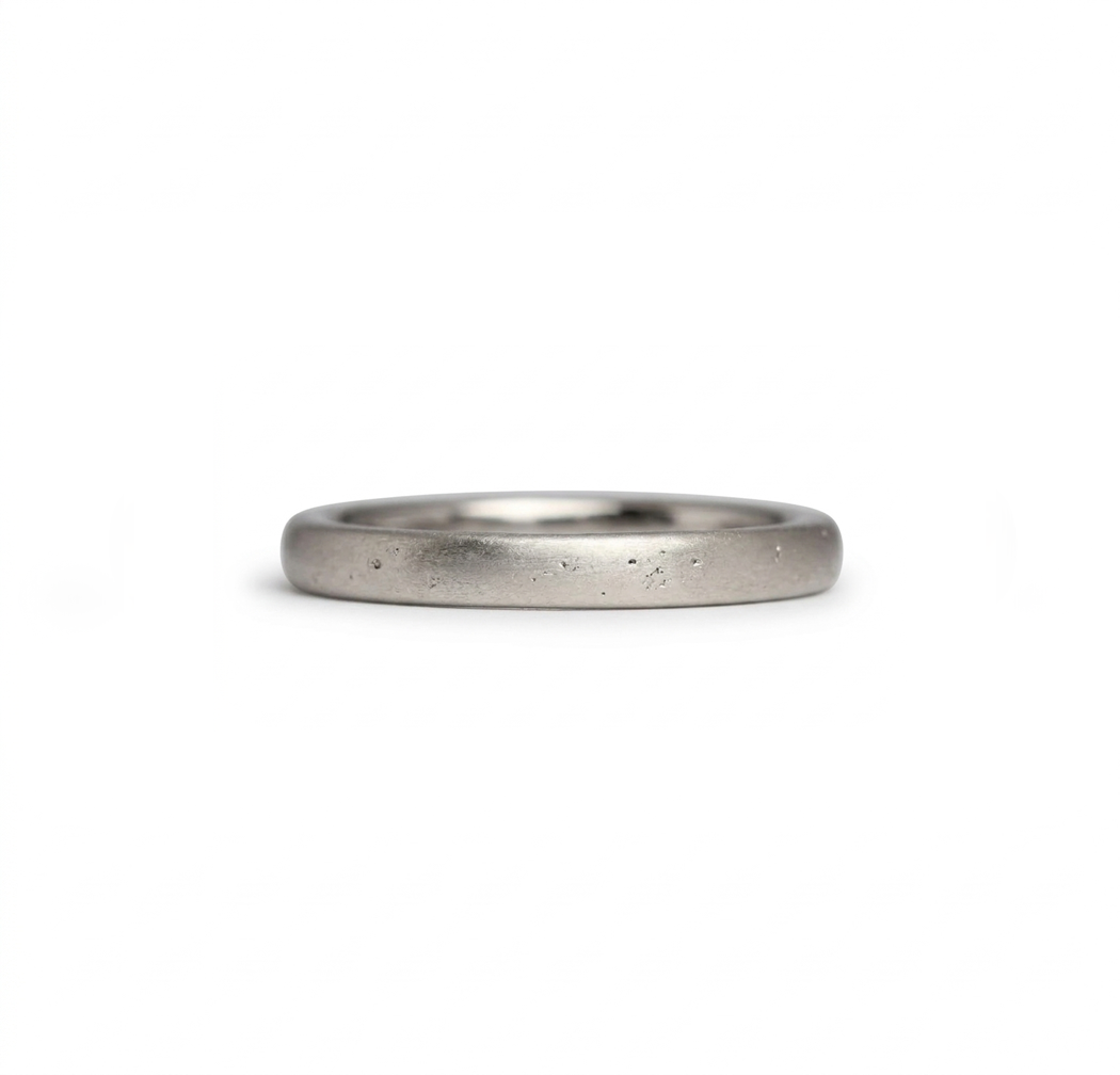 White gold wedding band made in Cornwall on the south west coastal path. Shem Hake jewellery.  