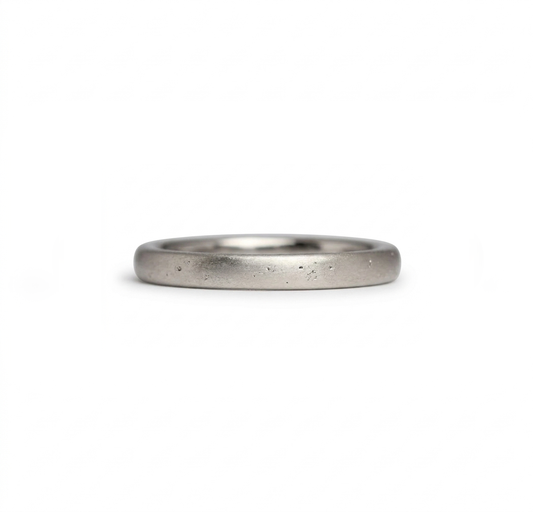 White gold wedding band made in Cornwall on the south west coastal path. Shem Hake jewellery.  