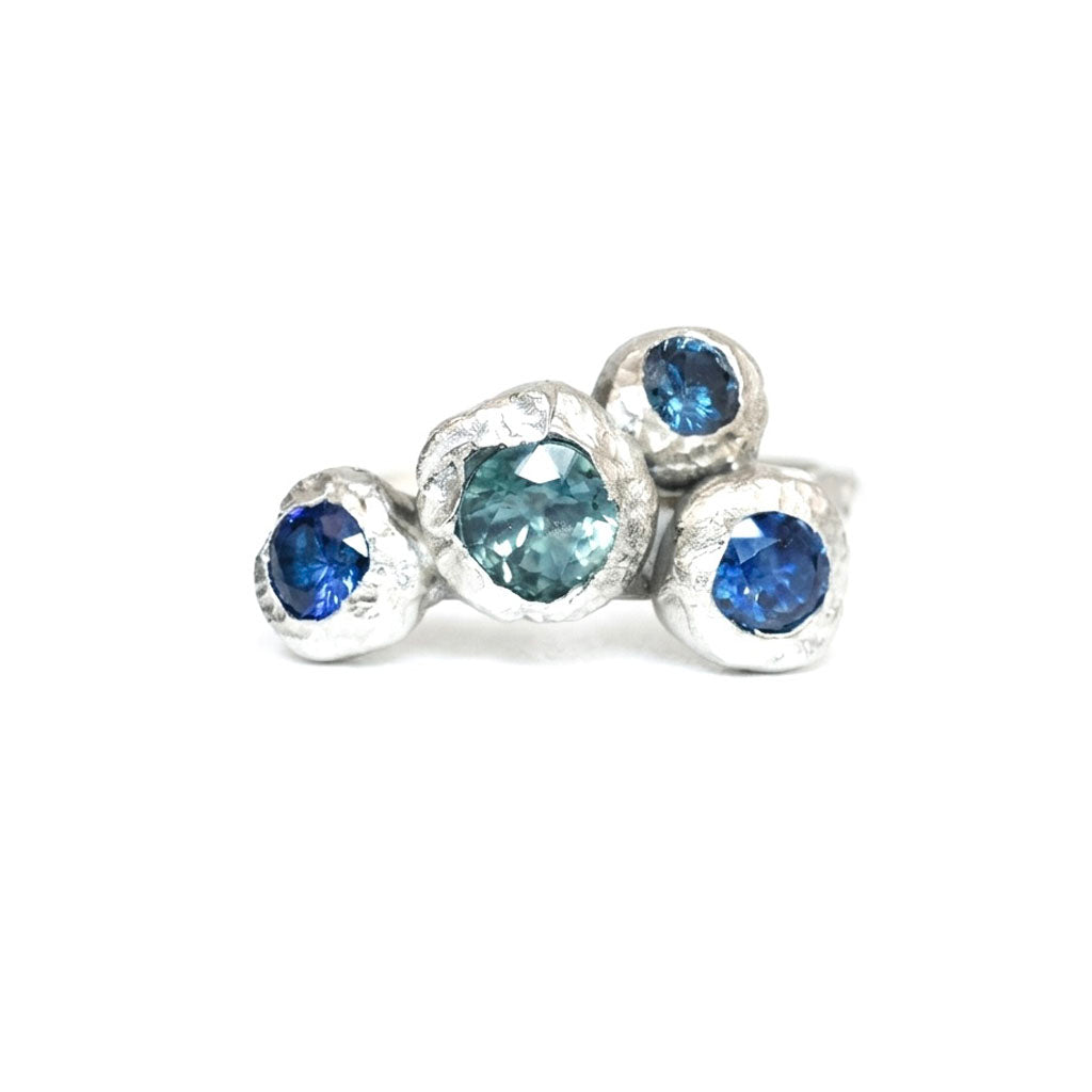 Silver organic ring with big sapphires. On a white background. Inspired by the Peak District. 