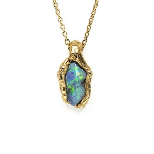 Opal pendant necklace on a gold chain against a white background. Jewellery made in st Ives, Cornwall. 